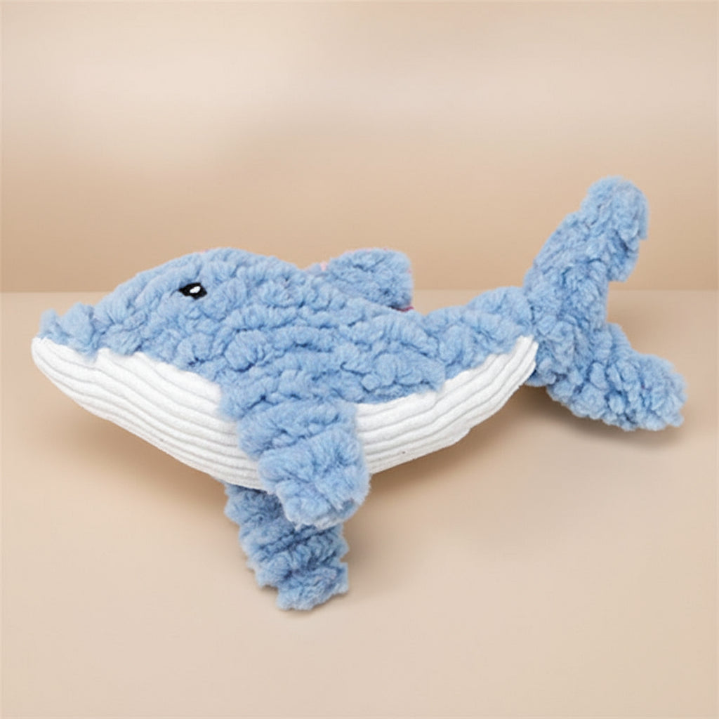 Blue plush shark toy with white belly on a white background