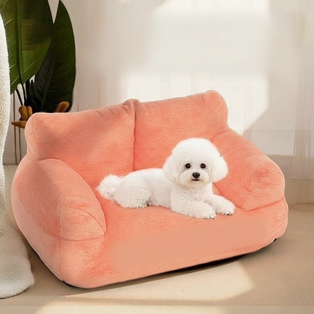 Peach-colored pet bed with a white dog lying on it, labeled 'Pawszen'.